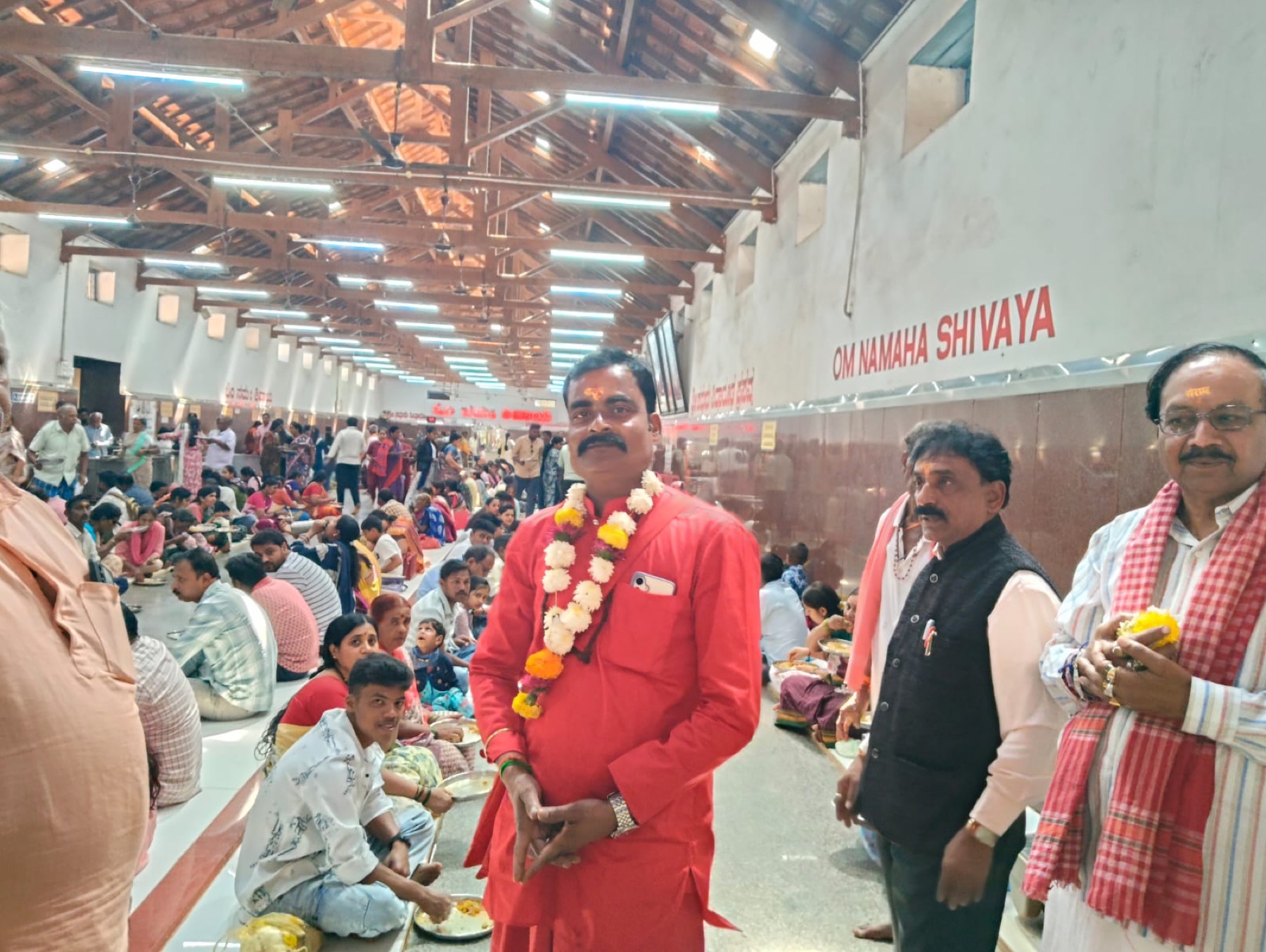 Devotees served food at a temple dining hall